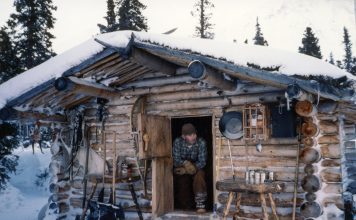 Dick Proenneke at his cabin in 1985. NPS photo taken by Richard Proenneke and donated by Raymond Proenneke